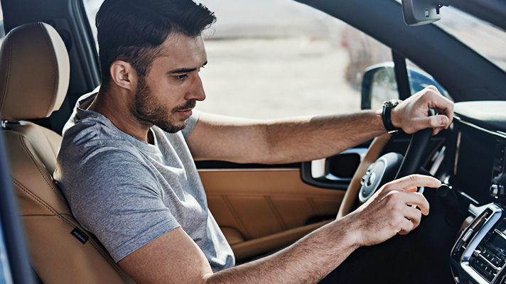 A driver in the driver's seat for a test drive