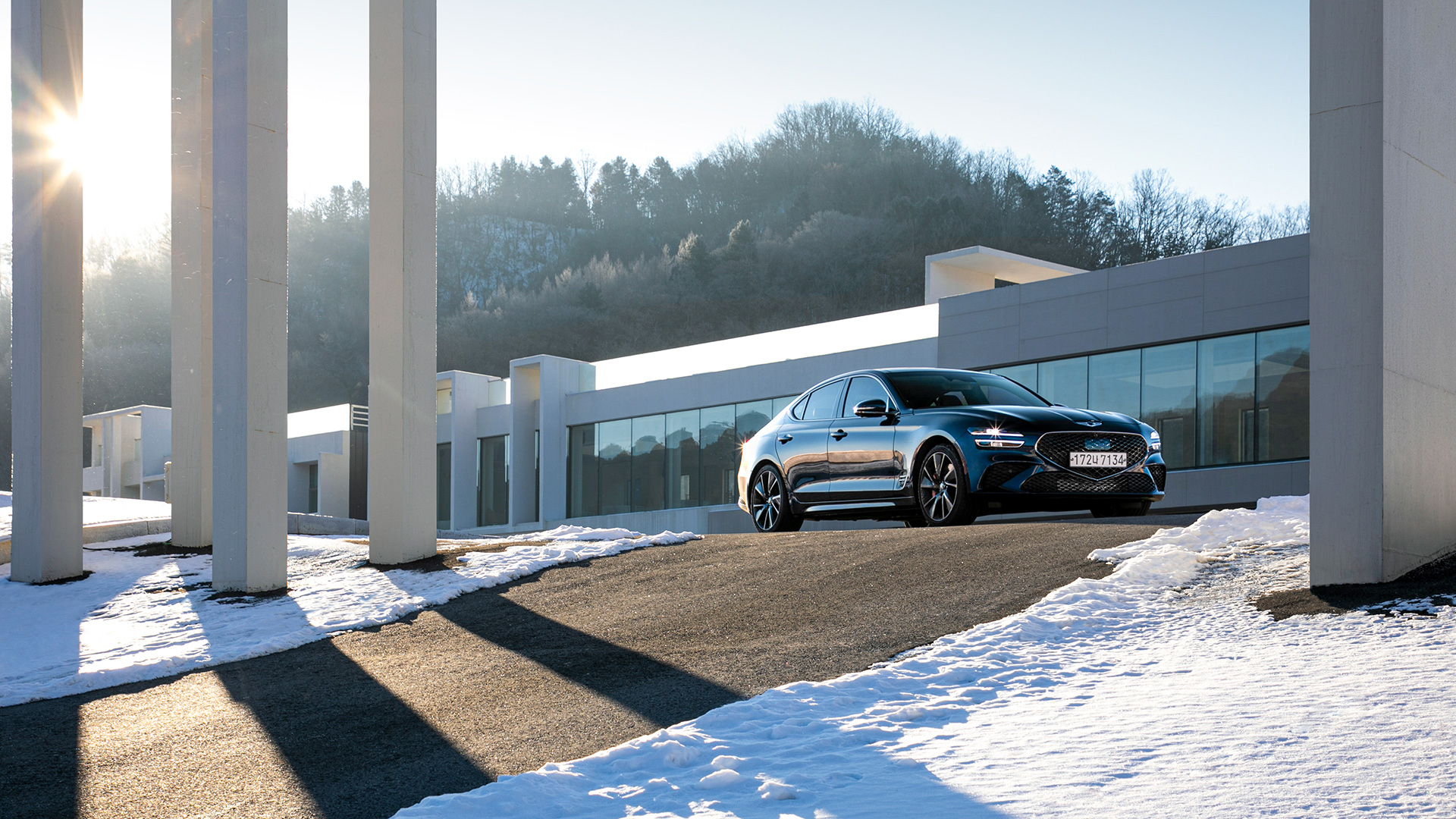 Low Angle view of tasman blue Genesis G70 on hill