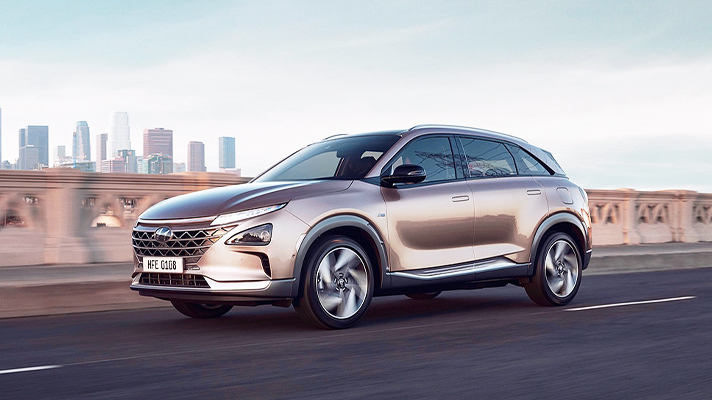 Side view of Hyundai Nexo running on the road