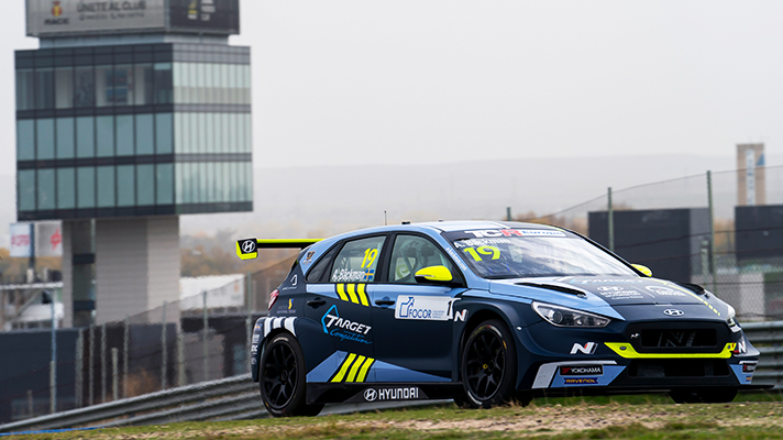 TCR racing car parked on the grass