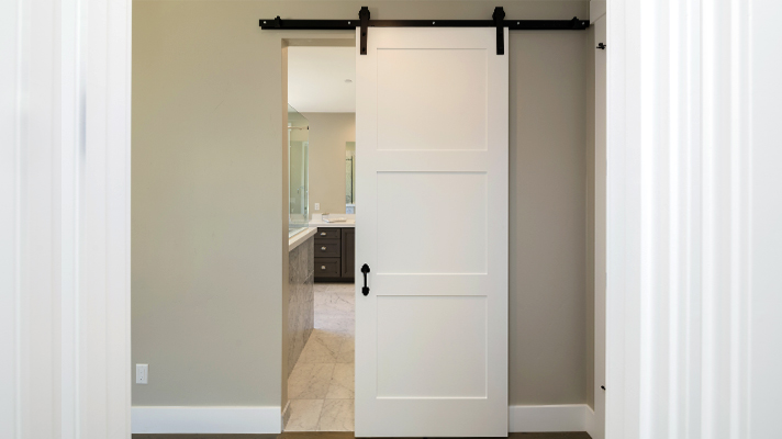 White sliding door installed in the house aisle