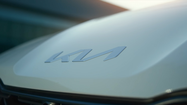 Kia new logo badge on vehicle bonnet hood
