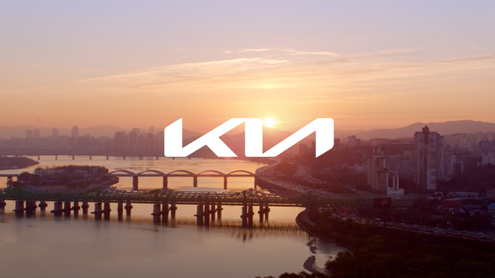Kia new logo in background of the Han River in Seoul as the sun rises