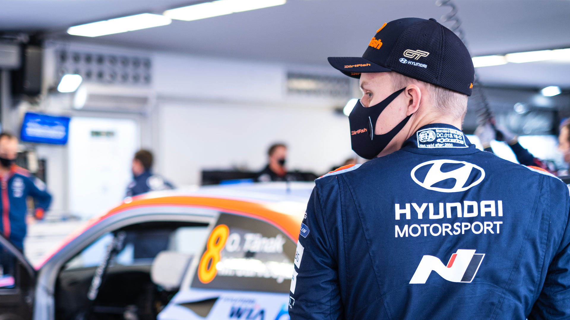 Hyundai motorsports team engineers servicing racing cars