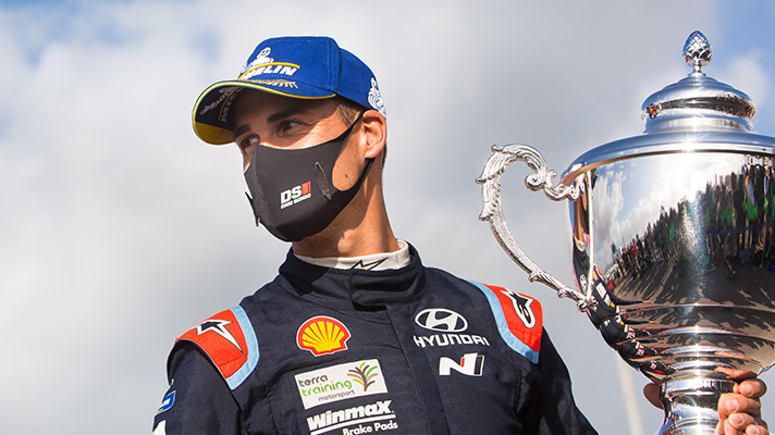 Dani Sordo holding the championship trophy