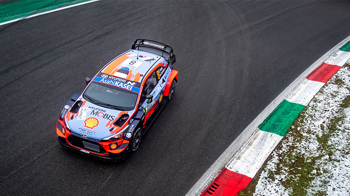 Hyundai Motorsports team racing car driving on the asphalt course