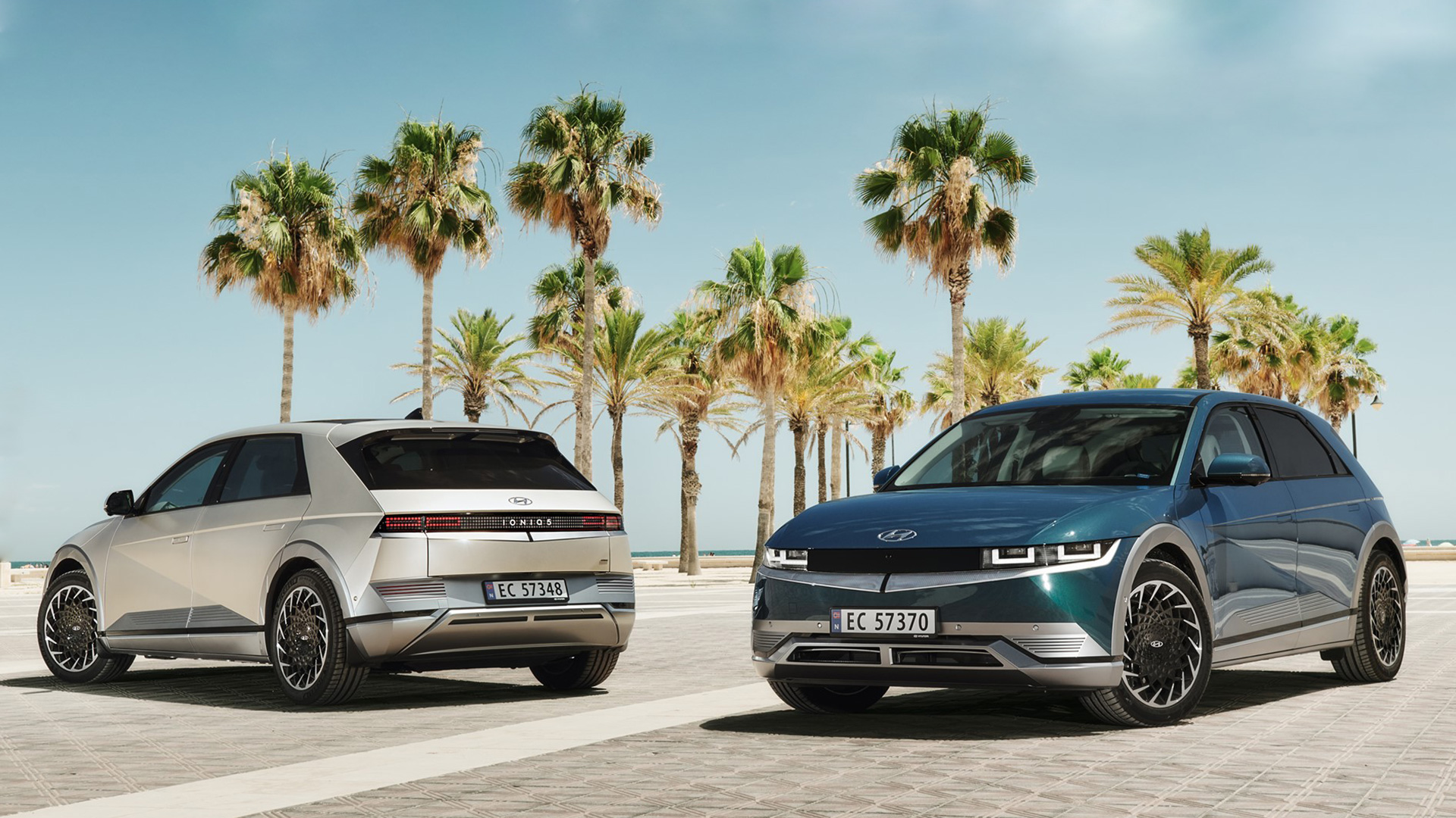 Two Hyundai IONIQ 5 parked on the beach