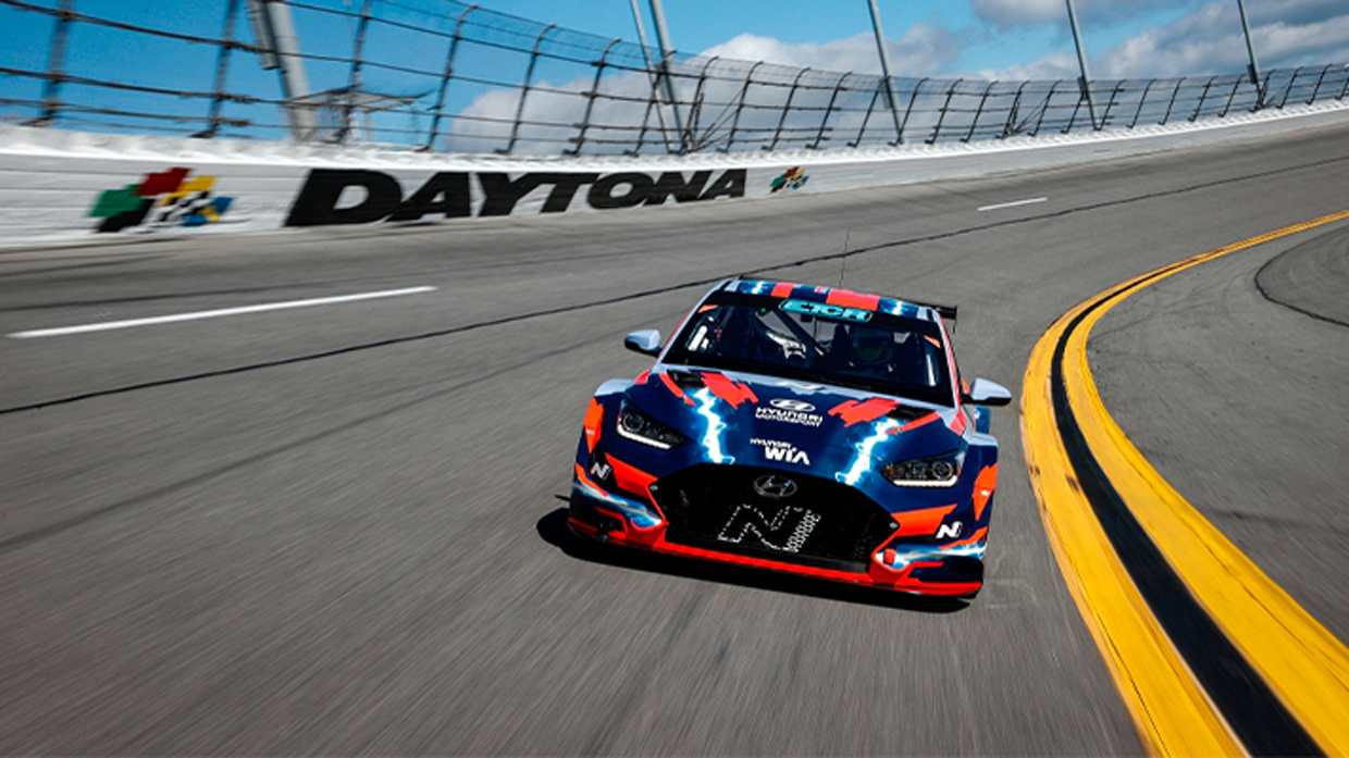 Front view of Hyundai Veloster N ETCR racing on track