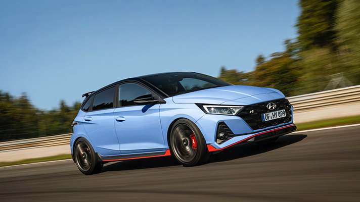 Blue Hyundai i20 N test driving on track