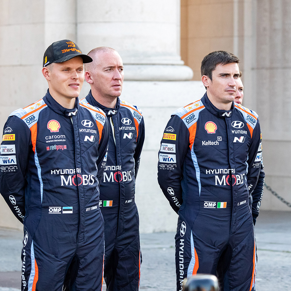 Hyundai Motorsports team driver standing side by side