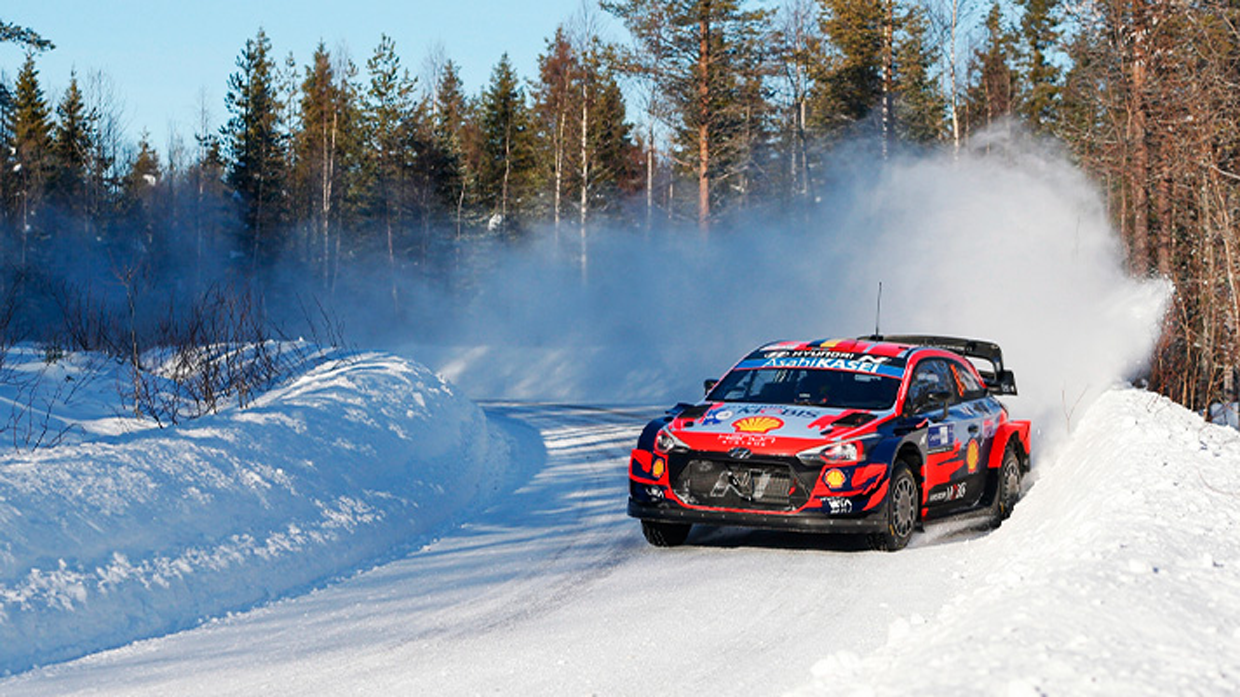 View of Hyundai motorsports team racing car driving fast