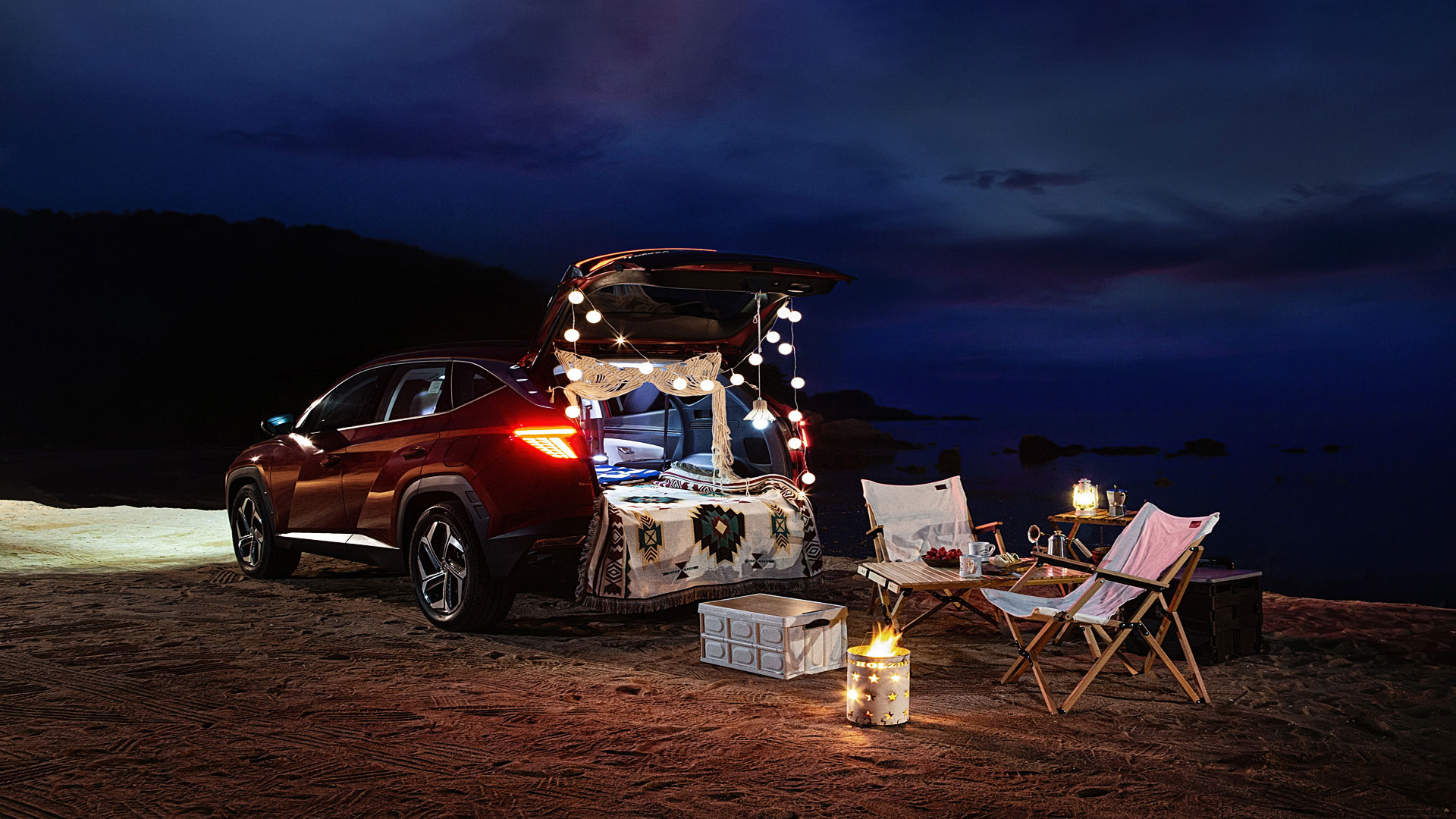 Hyundai Tucson night beach auto camping