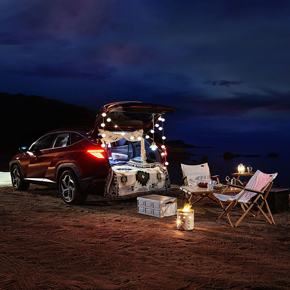 Hyundai Tucson night beach auto camping