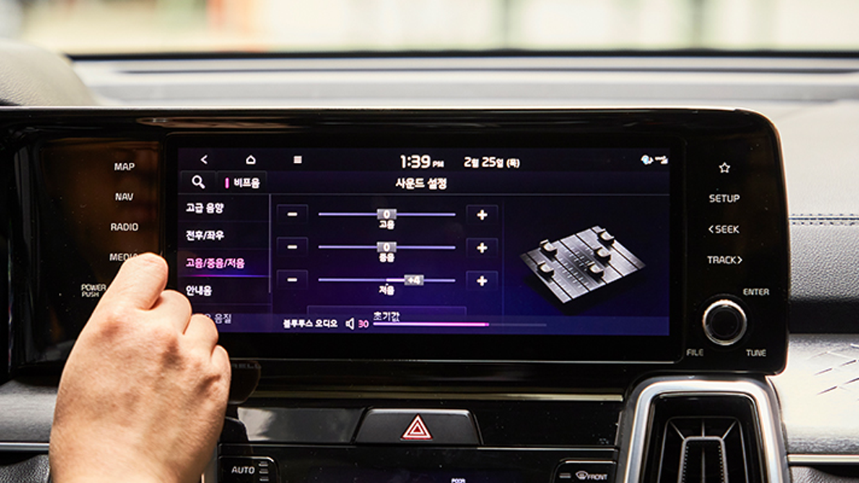 Image of hand operating the infotainment system