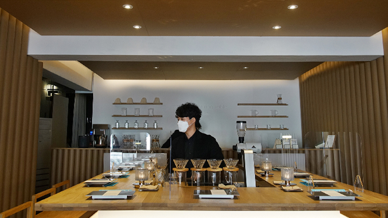 Barista making coffee at STUDIO I pairing table