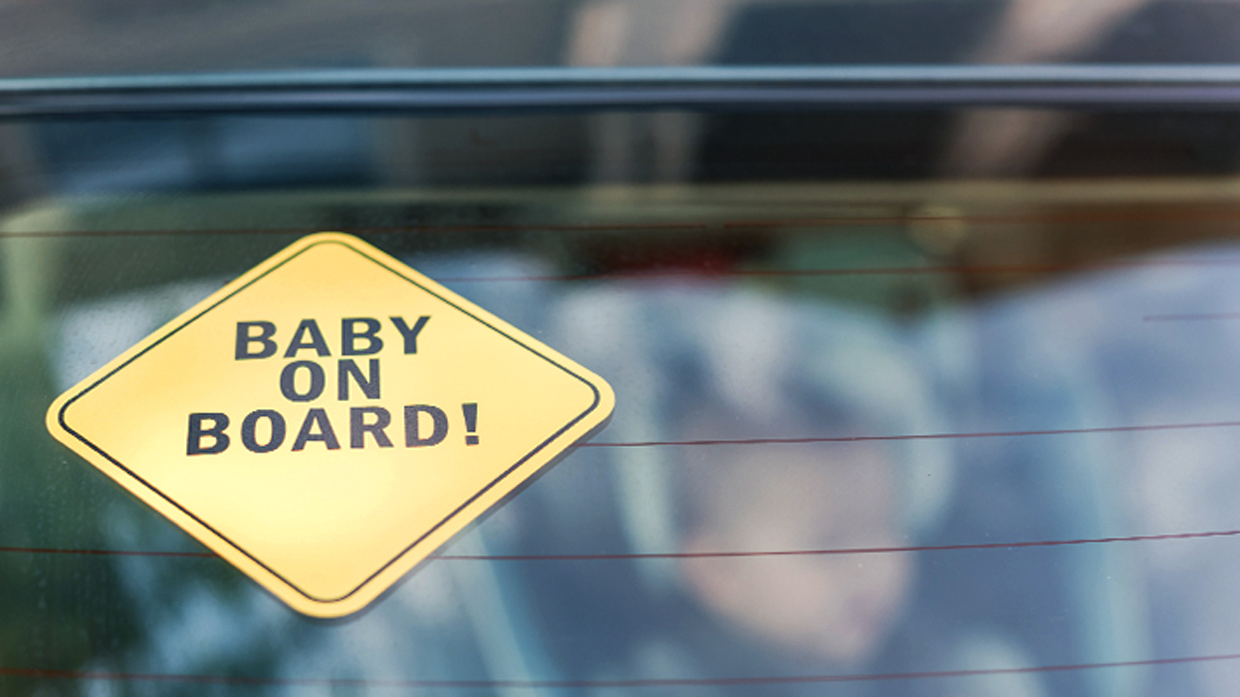 Rear view of car with sign of Baby on Boarding