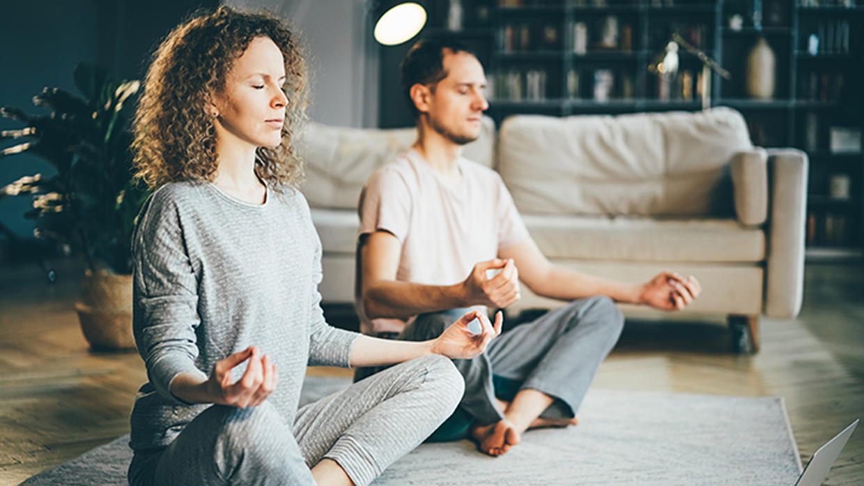 Image of man and woman meditating