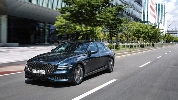 Front view of Genesis G80 running in the city