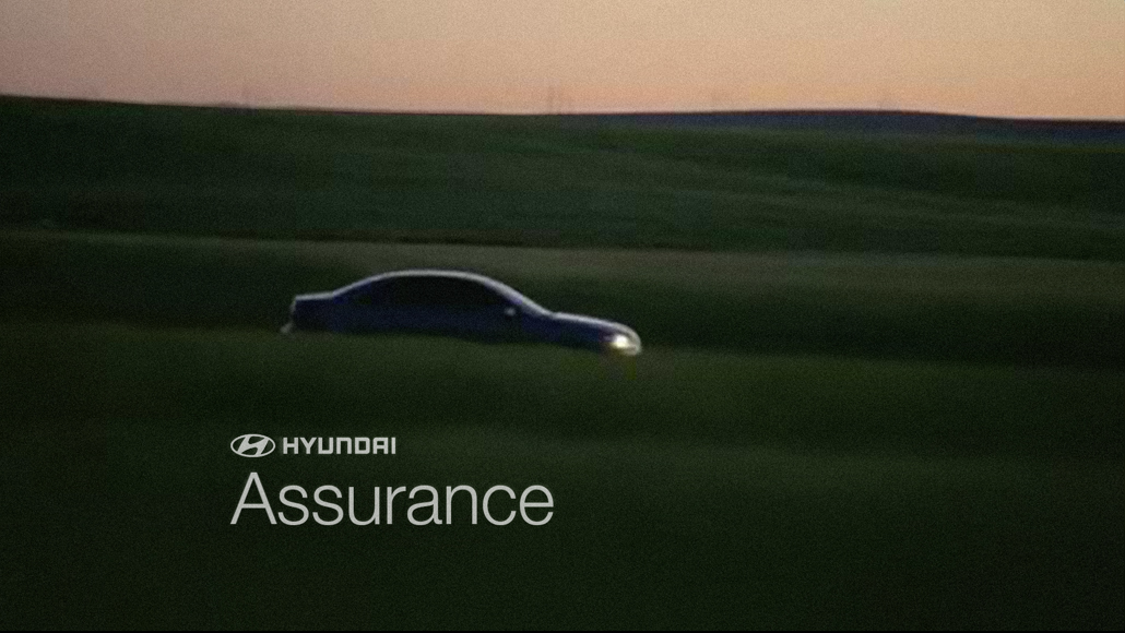 Screenshot of a car driving through a field during Hyundai Motor Company 2009 Assurance commercial