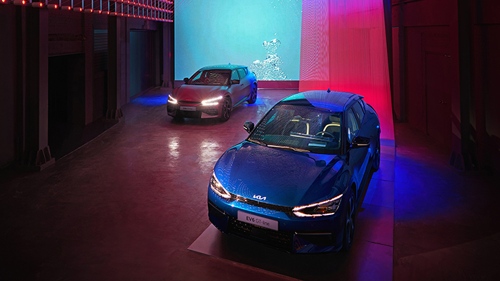 Two EV6s and a media wall on display in the Hello EV6 Zone