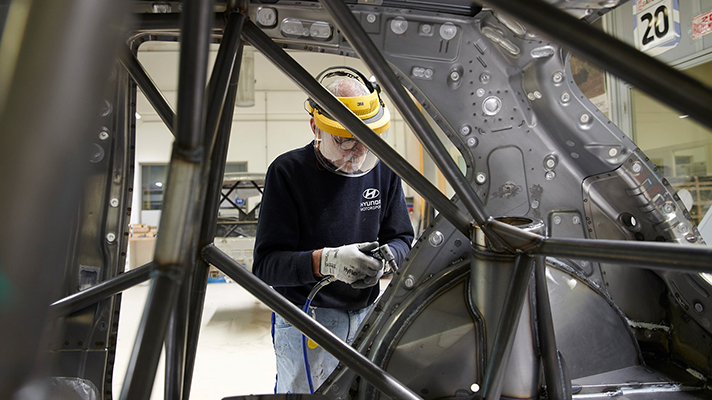 Photo of a rally car being remodeled