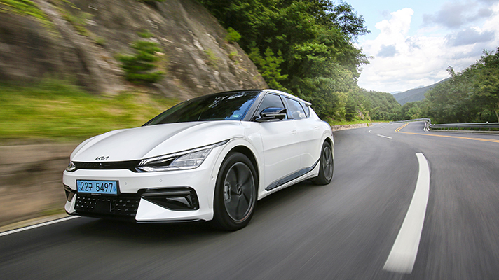 Front side view of EV6 driving fast on the road