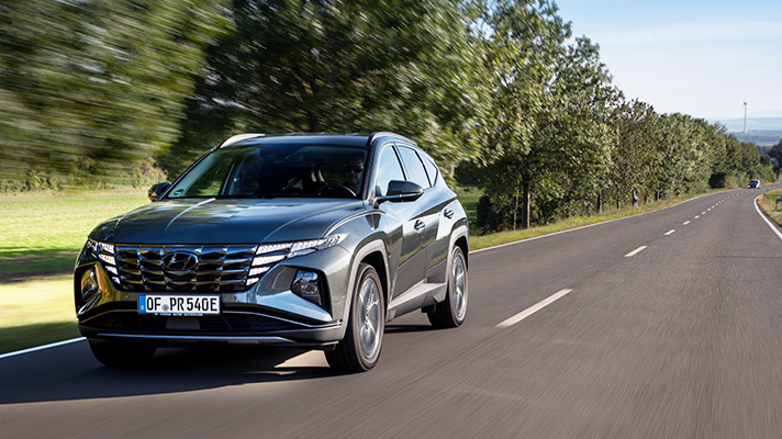 Front side of the Tucson PHEV running on the road