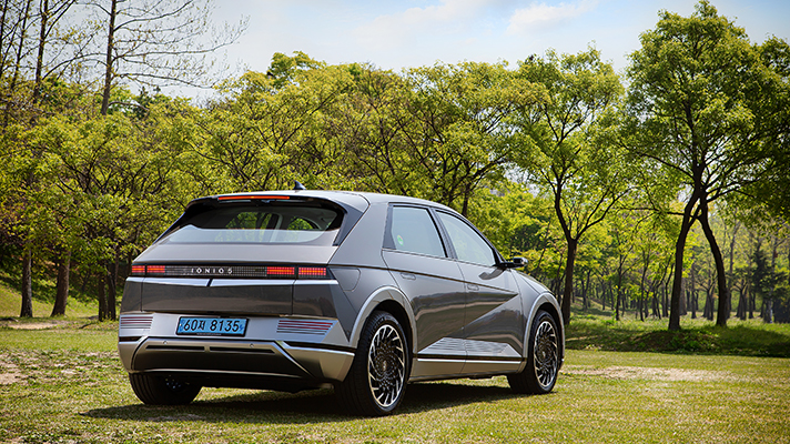 Rear view of Hyundai IONIQ 5 parked on the lawn