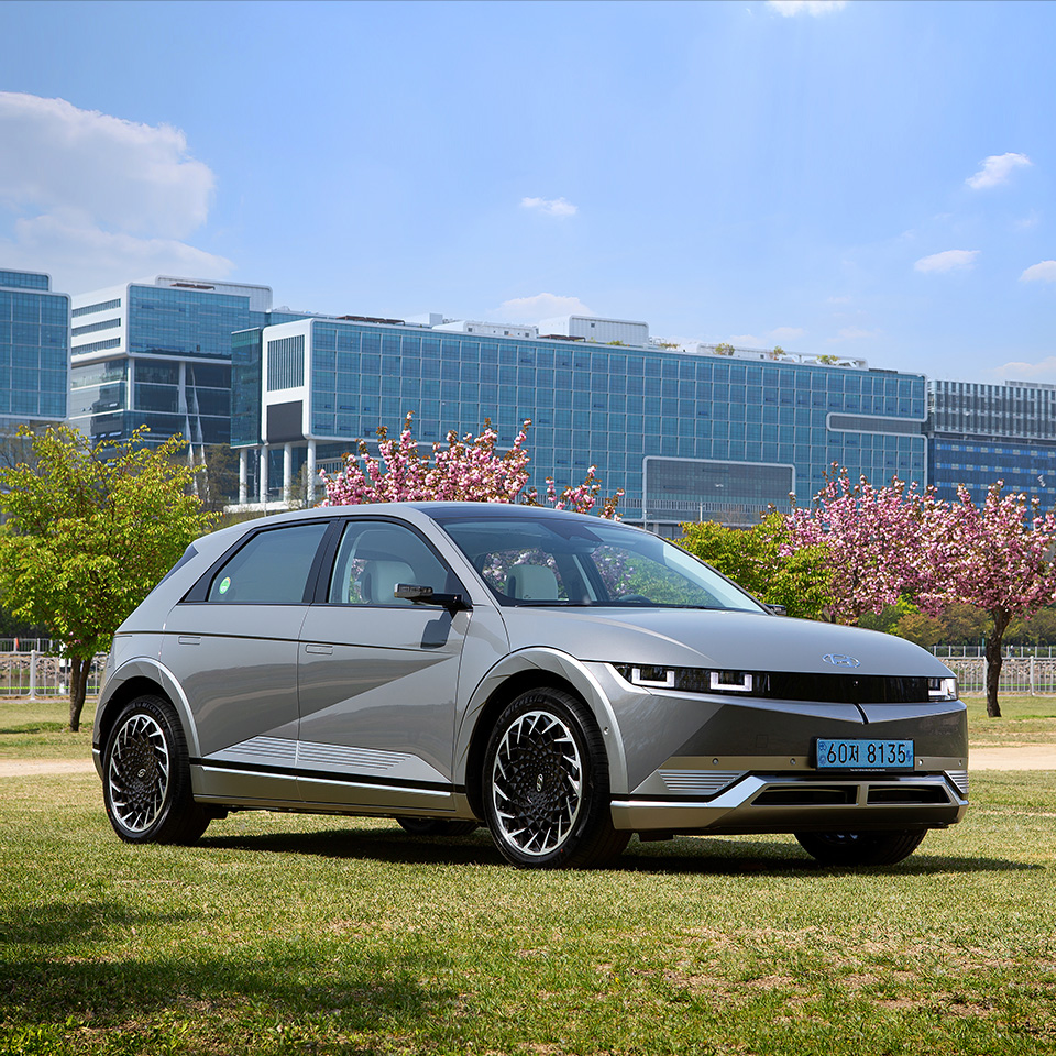 Side angle view of Hyundai IONIQ 5 parked on the lawn