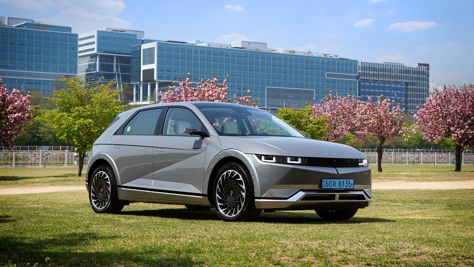 Side angle view of Hyundai IONIQ 5 parked on the lawn