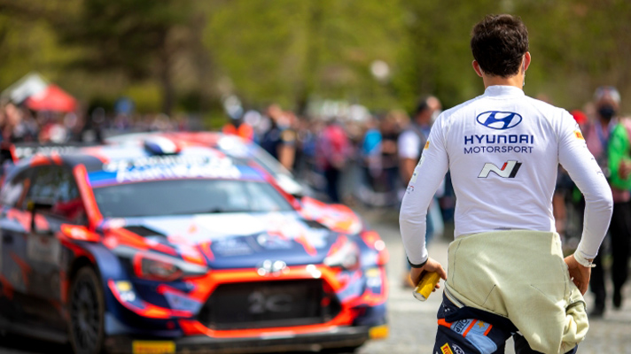 The driver walking to Hyundai i20 Coupe WRC