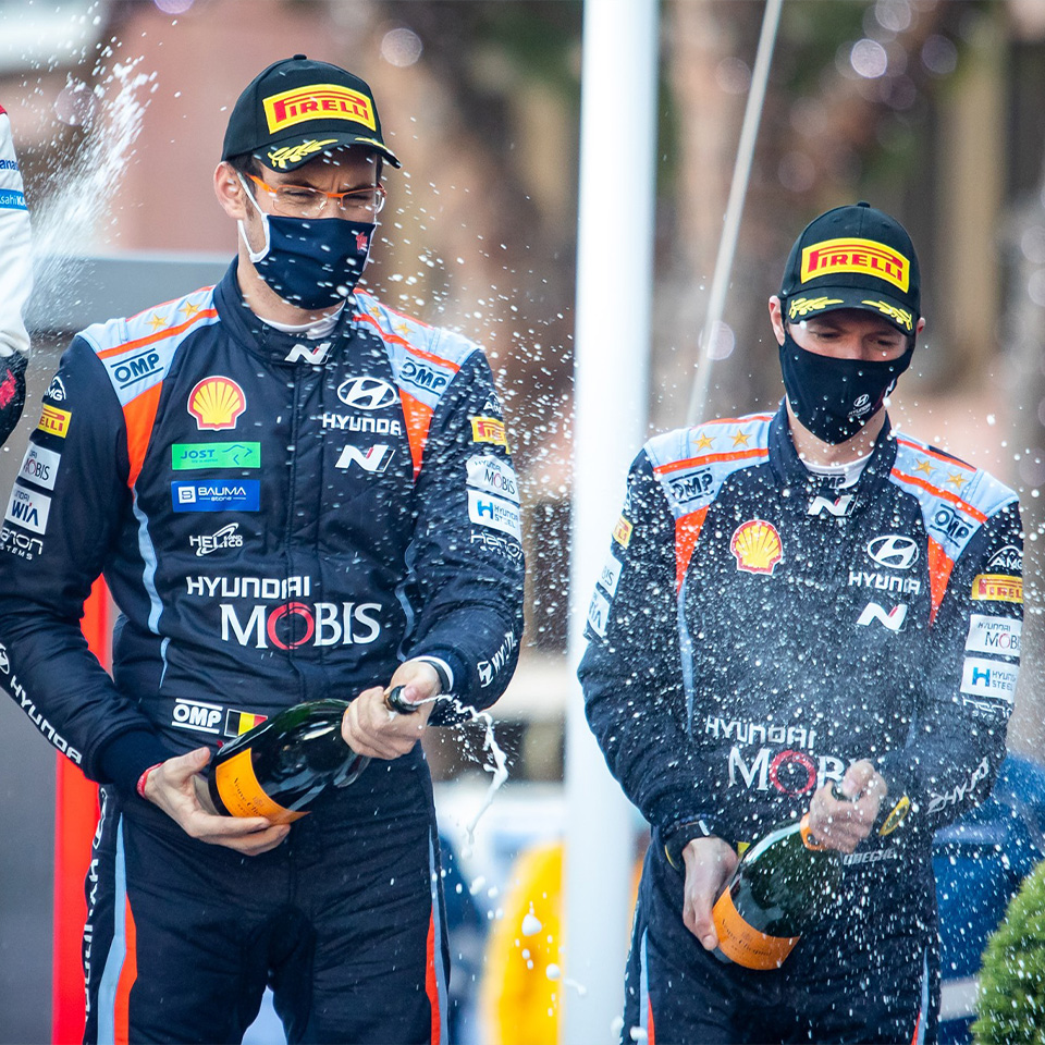 Hyundai motorsports team Thierry Neuville celebrating the second with co-driver at podium