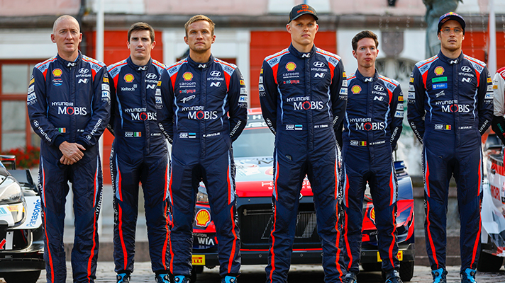 Hyundai Motorsports team driver standing side by side