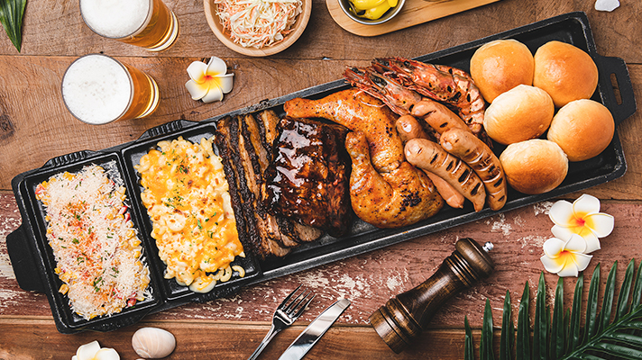 Top view of Hawaiian BBQ on a wooden table