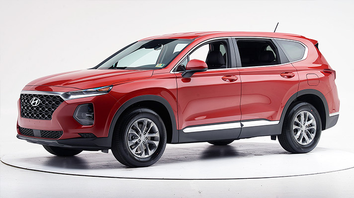 Side view of 4th-generation red Santa Fe