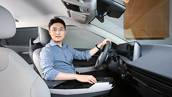 Kim Jeongjae Kim sitting in driver seat of the Kia EV6 GT