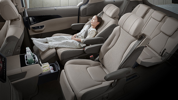 Girl lying on second-row premium relaxation seats
