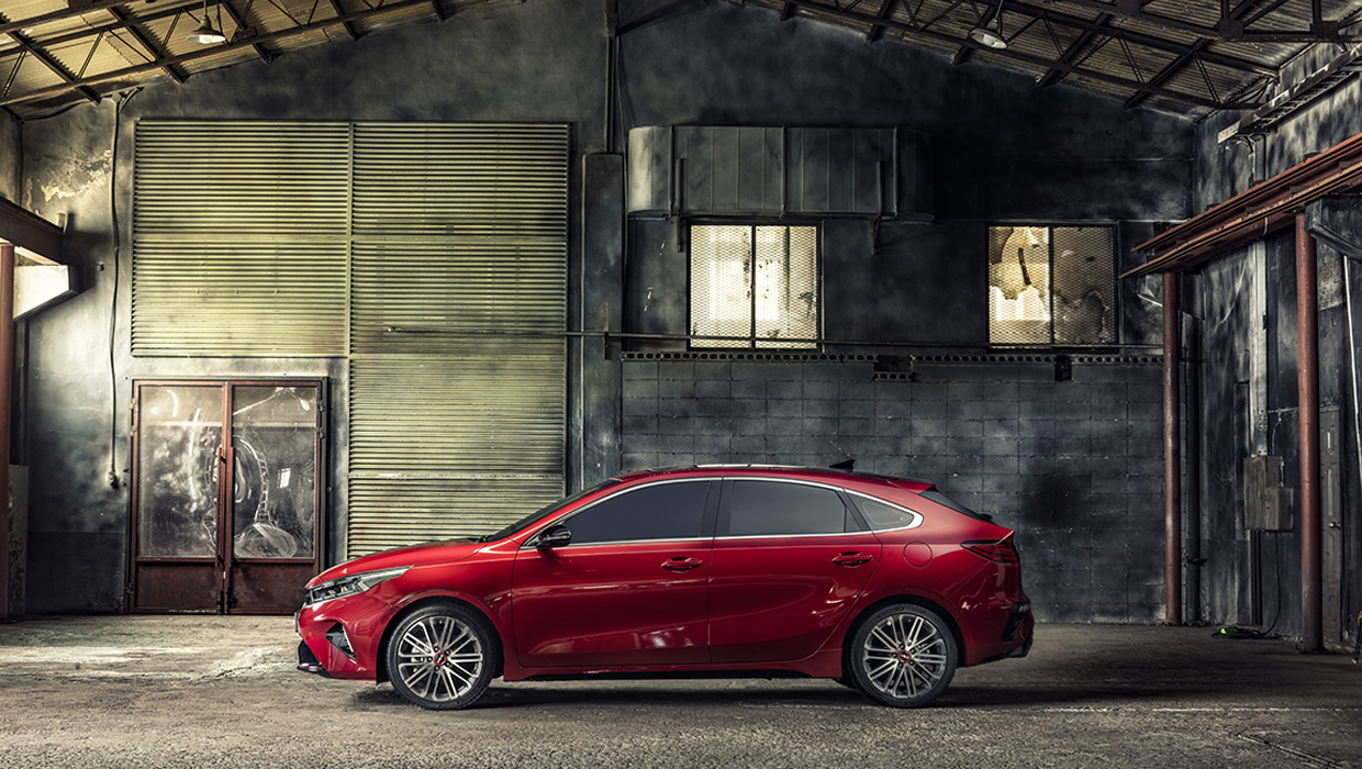Kia K3 GT's slim profile from the abandoned warehouse studio
