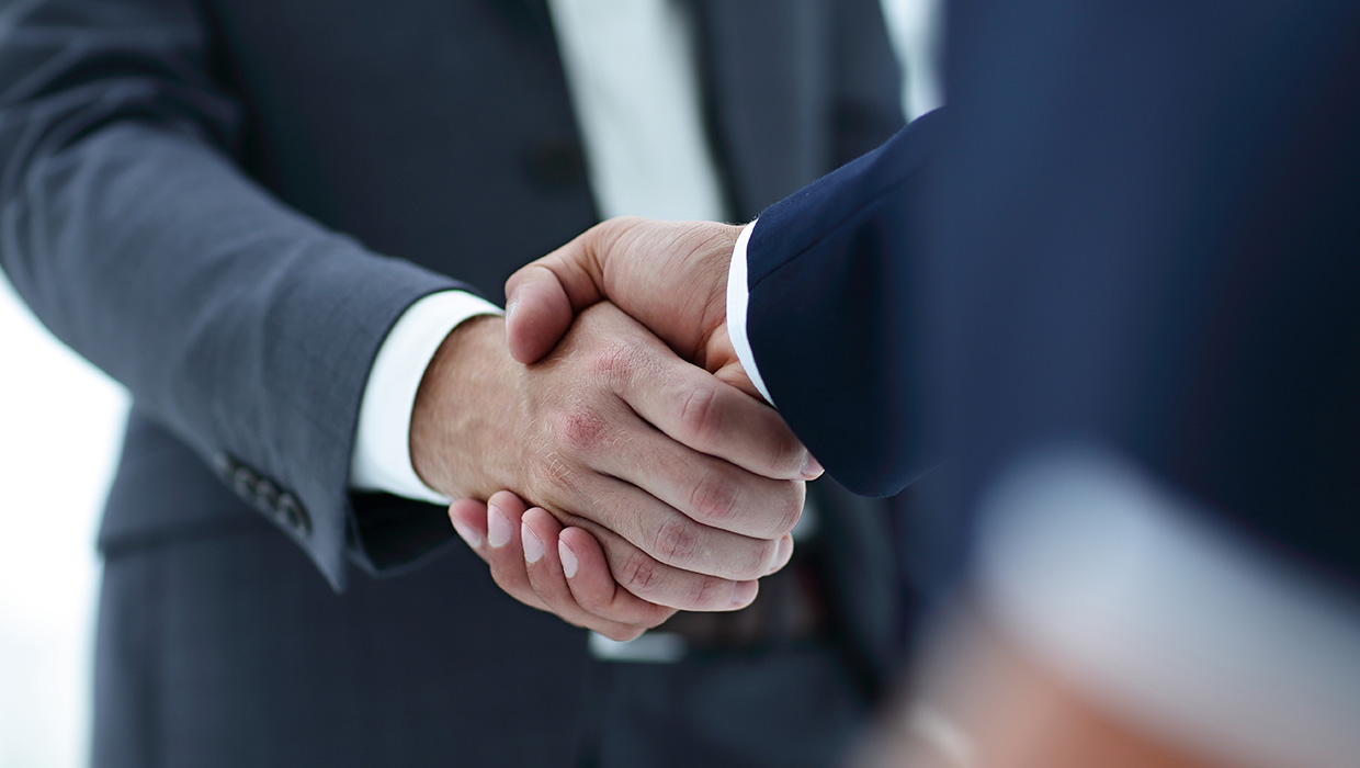 Close-up of hands shaking hands