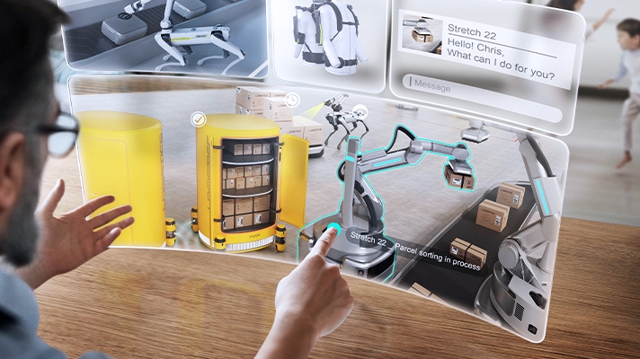 인간의 육체노동을 대신하는 로봇에 모니터로 명령을 내리는 남자의 모습