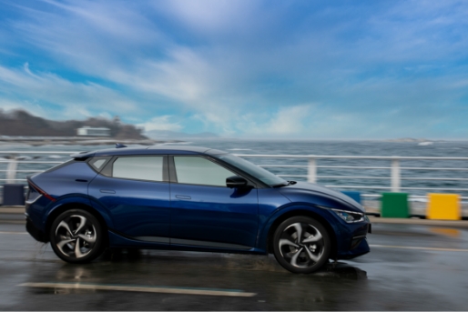 Kia EV6 driving along the beach