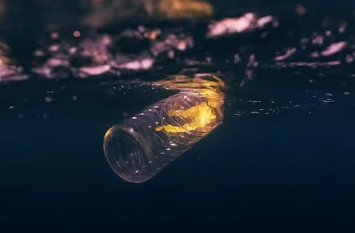 An abandoned plastic bottle floating in the sea