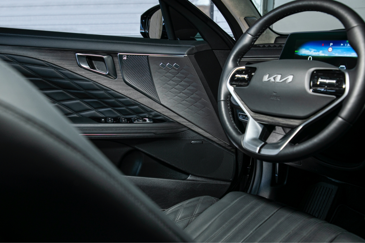 Driver's door trim with speaker attached