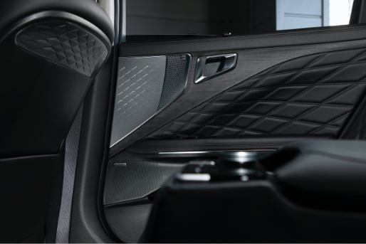 Rear door trim with speaker attached
