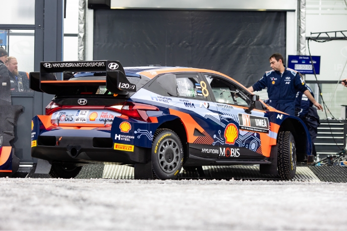 Rally car with studded tires to run on snow