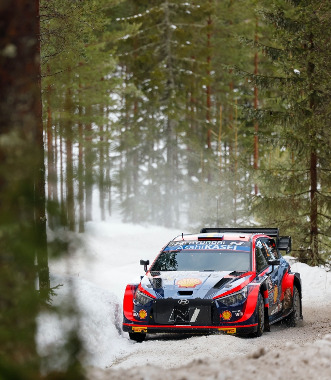 The unusual scenery of Rally Sweden running through the snow in the forest