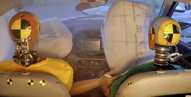 Airbags are inflating after a collision with a dummy in