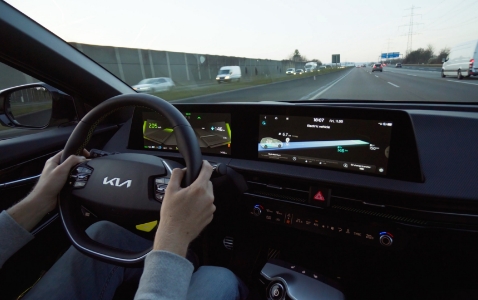 The driver's seat of a Kia EV6 GT driving at high speed on the German Autobahn