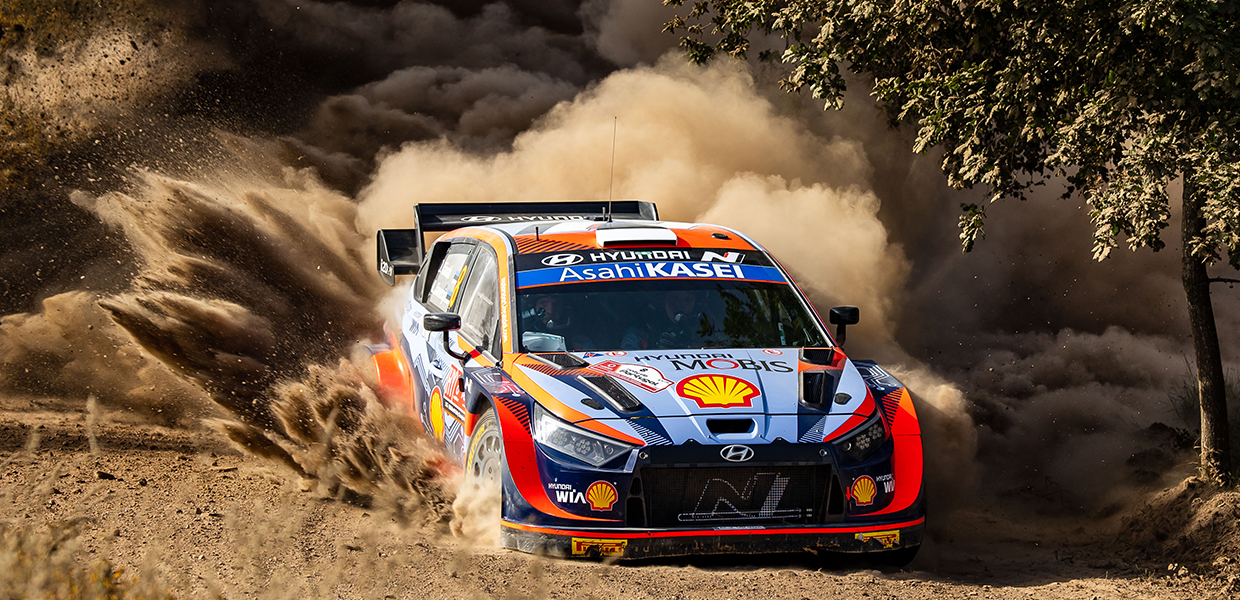 The i20 rally car speeding up while splashing the sand