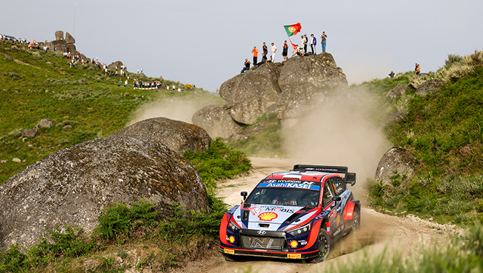 The i20 rally car is running on a mountain course